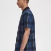 Polo à col zippé et motif tartan Glitch pour homme