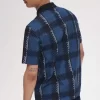 Polo à col zippé et motif tartan Glitch pour homme
