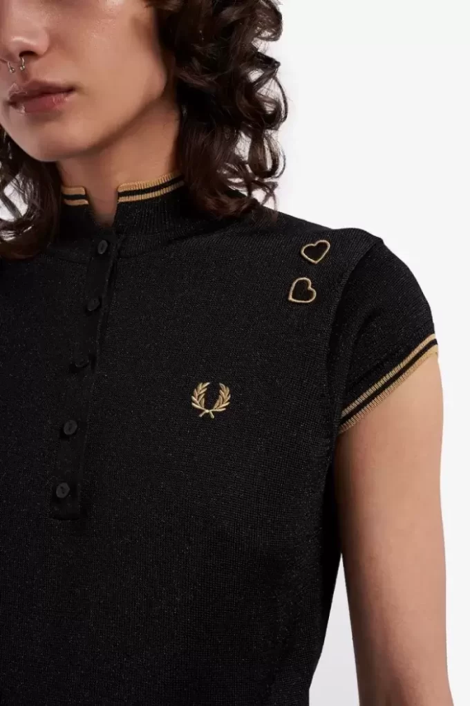 Polo femme en maille métallisée