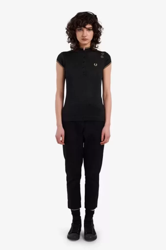 Polo femme en maille métallisée