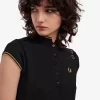 Polo femme en maille métallisée