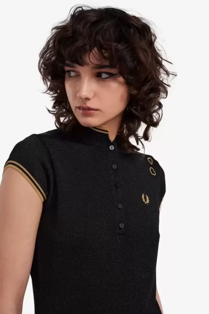 Polo femme en maille métallisée
