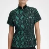Polo femme à imprimé serpent