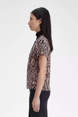 Polo femme à imprimé zèbre