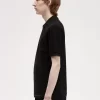 Polo texturé à col zippé pour homme