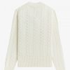Pull en maille torsadée à col en V
