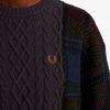 Pull en maille torsadée à empiècements tartan
