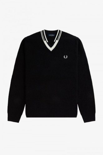 Pull en tricot à col en V et à pointes abstraites