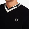 Pull en tricot à col en V et à pointes abstraites